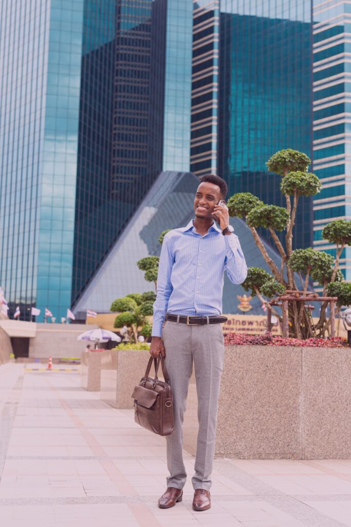 Professional young man on phone in city environment